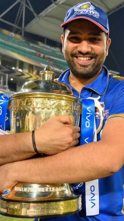Rohit Sharma hugging the IPL trophy in Mumbai Indians colours